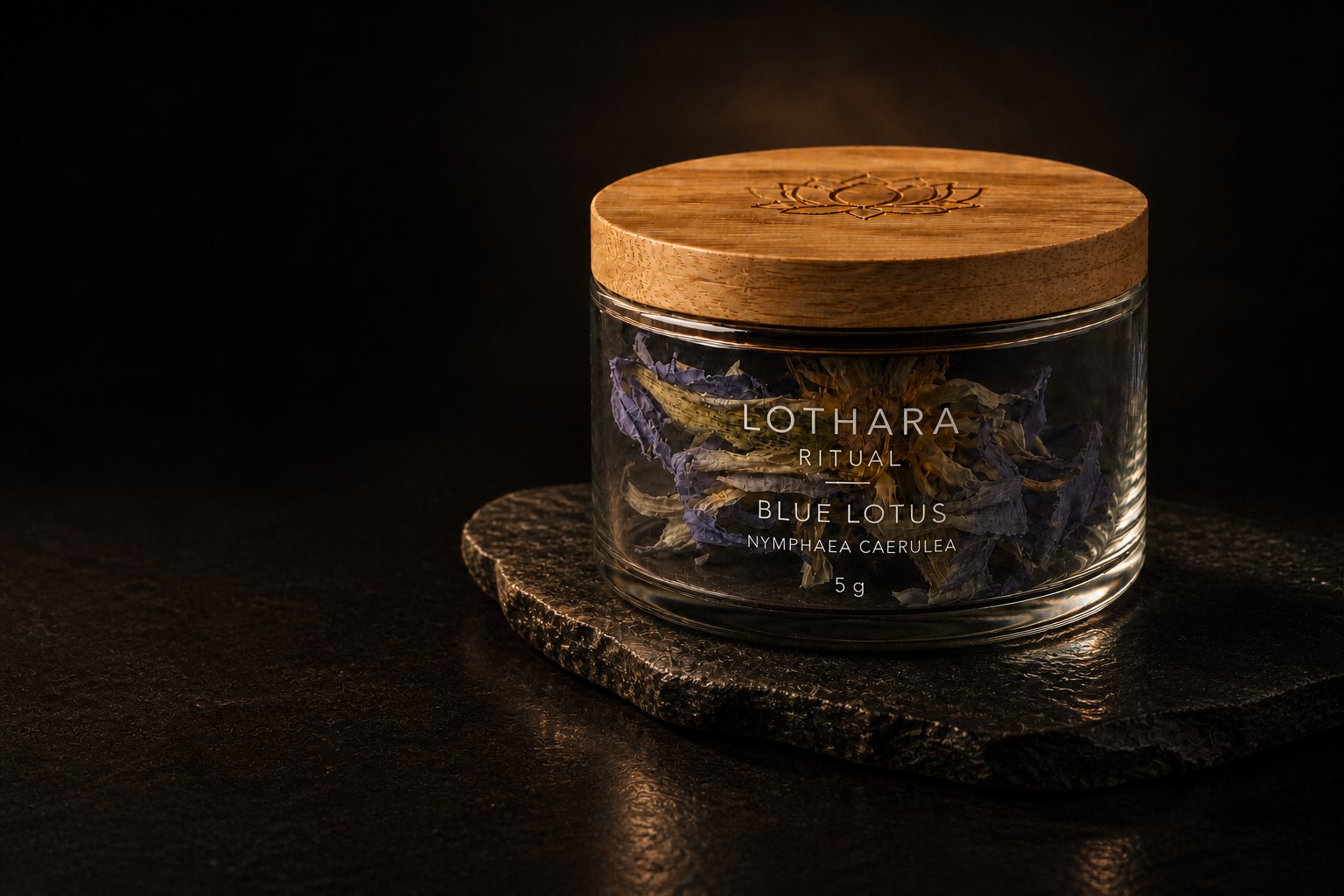 LOTHARA Blue Lotus — whole dried Nymphaea caerulea flowers in a glass jar with a bamboo lid, on dark stone